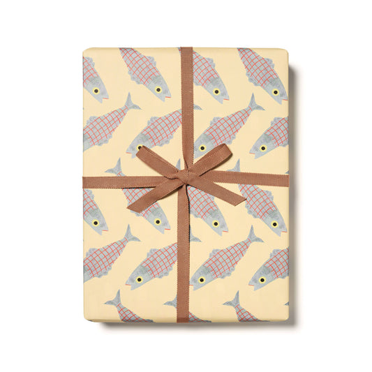 Gift wrap with herring fish pattern and brown ribbon on a white background