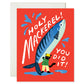 Greeting card with a big fish and a cat wearing fisherman's clothes, on a red background, featuring text 'Holy Mackerel! You Did It!'.