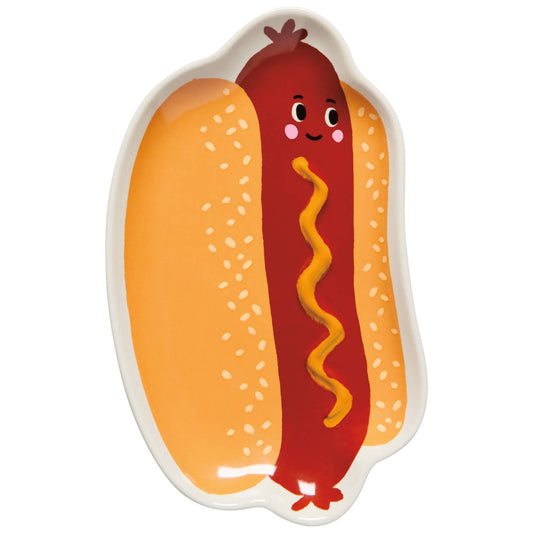 Plate shaped like a hot dog with a face on a bun against a white background