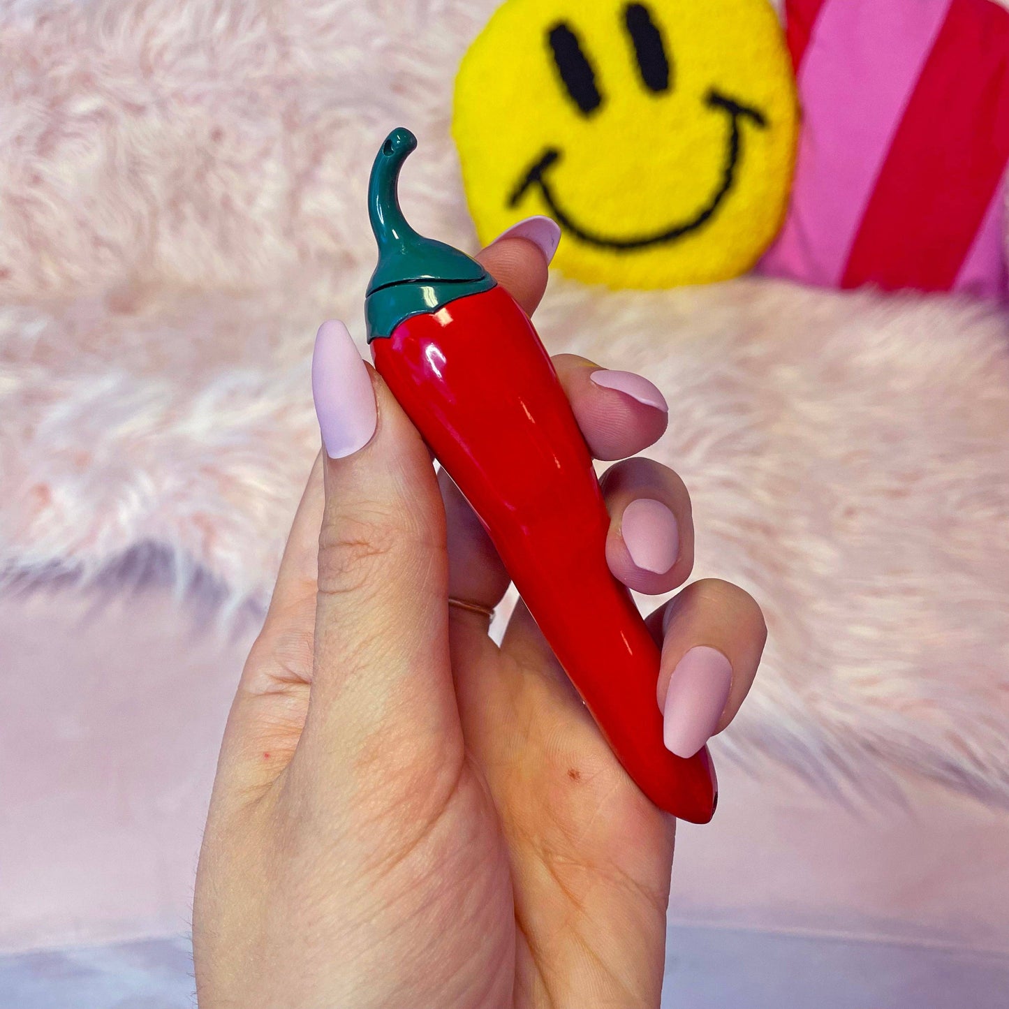 a lighter shaped like a red chili pepper 