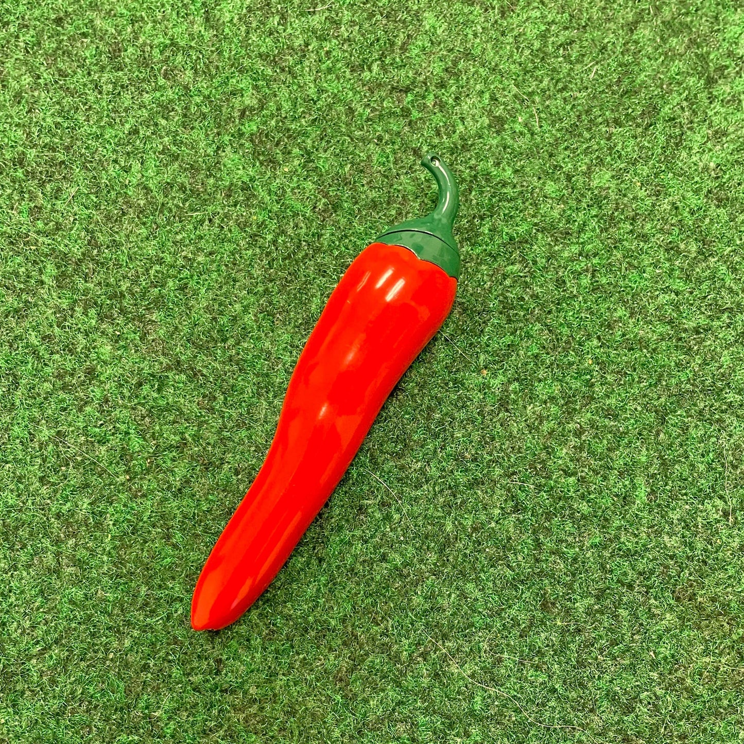 a lighter shaped like a red chili pepper 