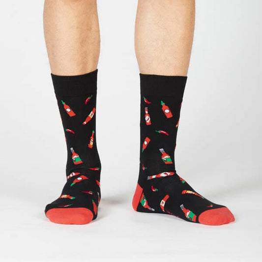 black crew socks with red toe tips. design has bottles of hot sauce and chili peppers all over 