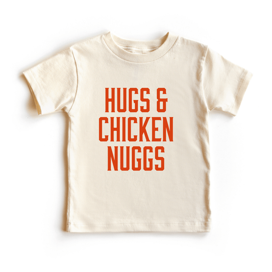 Cream colored baby shirt size 2T with orange text that reads "Hugs & chicken nuggs" 
