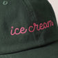 close up details of embroidery on black ice cream hat 