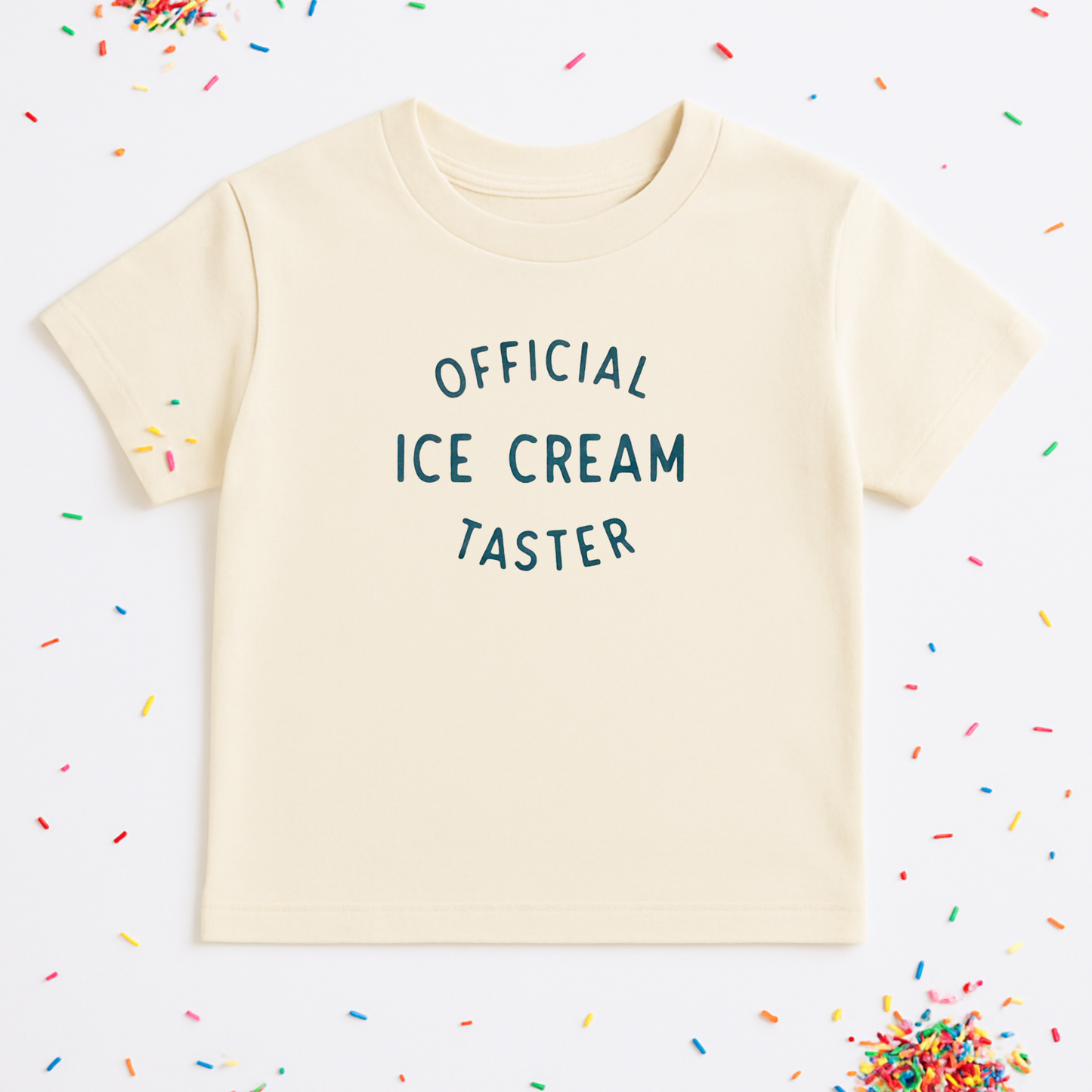 Beige t-shirt with 'Official Ice Cream Taster' text on a white background with colorful sprinkles.