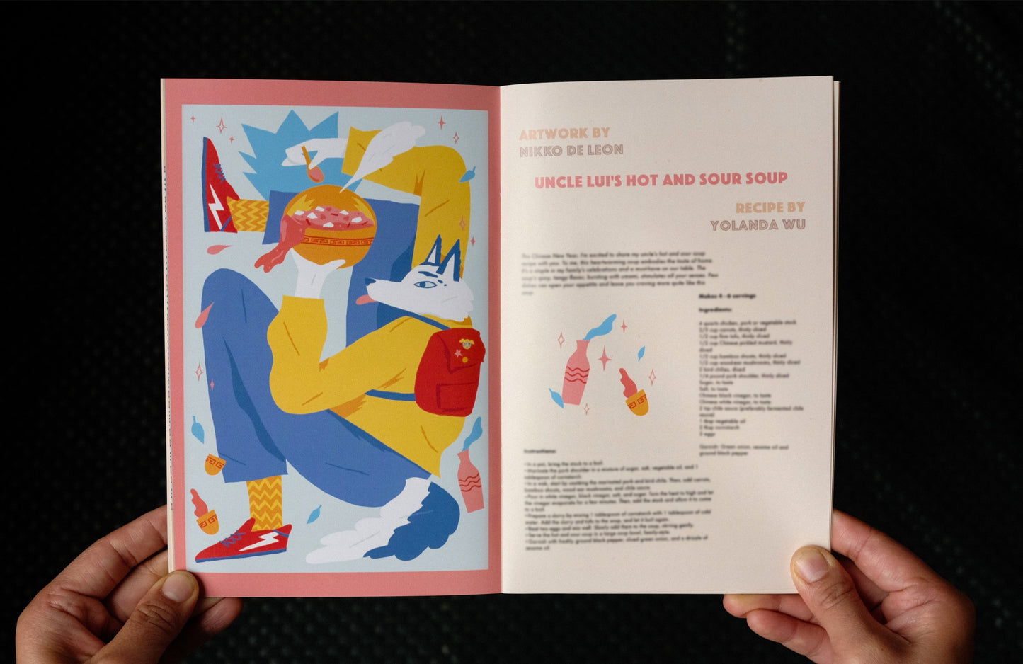 Inside pages featuring artwork by Nikko de Leon and Recipe by Yolanda Wu. Picture is of a fox with bowl of soup.