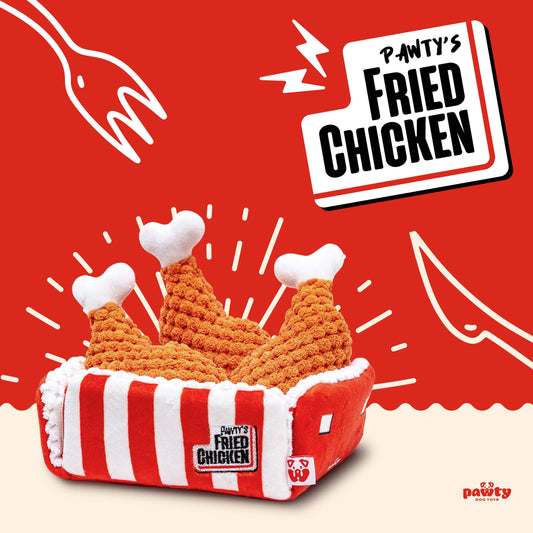 Fried chicken-shaped pet toy with 'Pawty's Fried Chicken' branding on a red background.