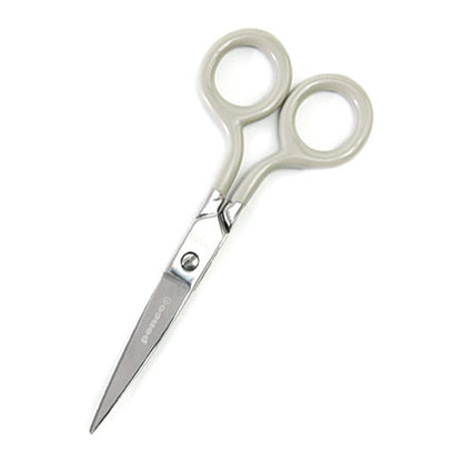 Photo of stainless steel scissors with ivory colored handle.