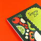 Latin themed grocery list notepad featuring various latin food ingredients including tomatoes, garlic, beans, corn, onion, peppers, lime and rice