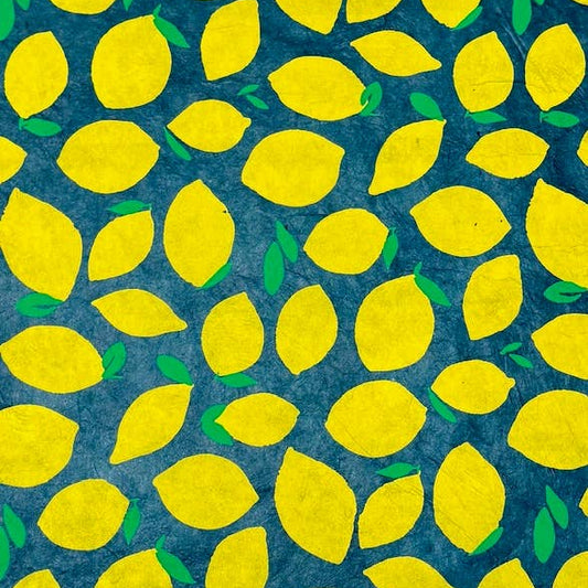 A repeating pattern of bright yellow lemons with small green leaves on a dark blue textured background.