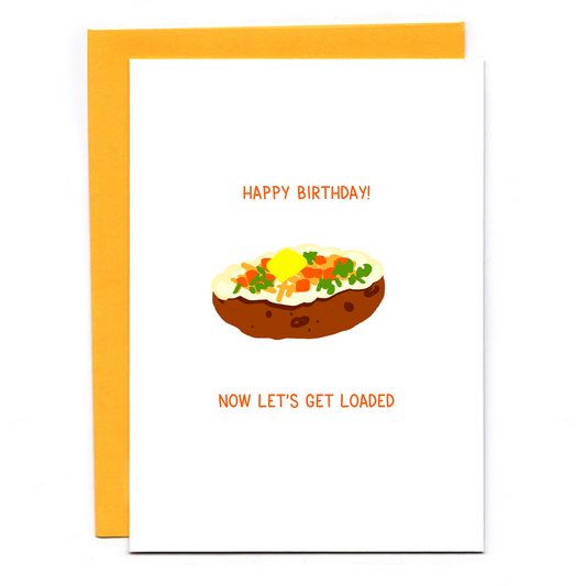 Birthday card with a fully loaded baked potato on it. Text reads: Happy Birthday! Now let's get loaded. Orange envelope.