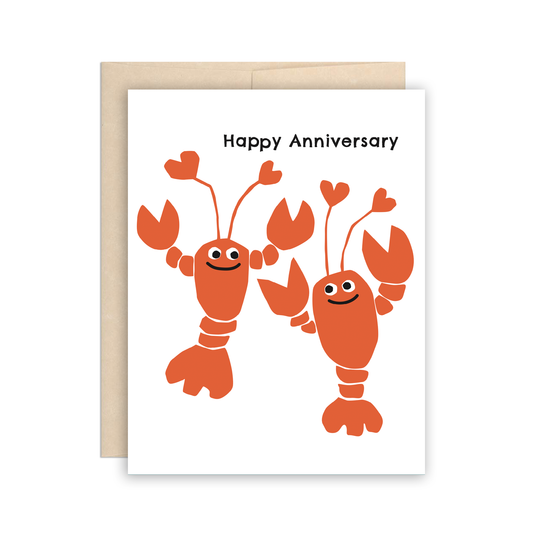 Anniversary greeting card with two red smiley lobsters on it, whose antennas are heart-shaped