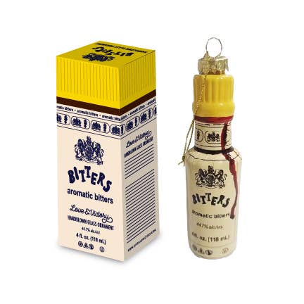 holiday ornament that looks like a bottle of aromatic bitters with matching box packaging