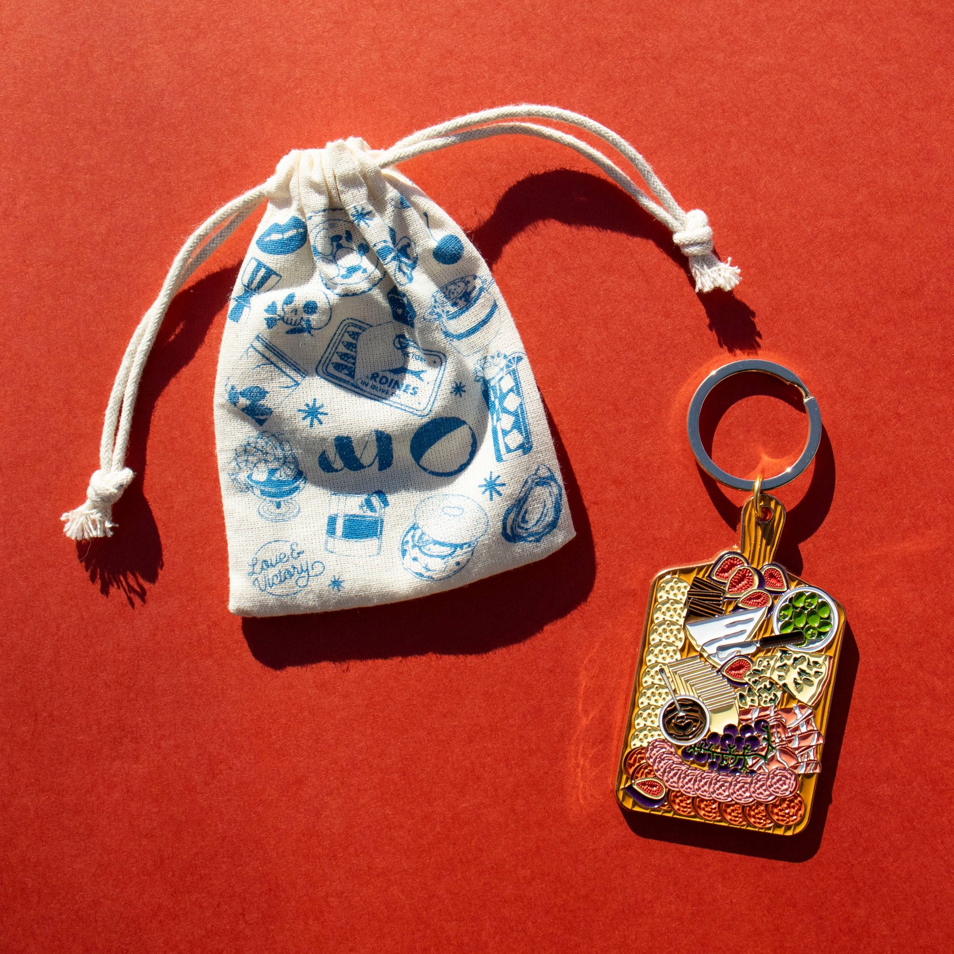 Charcuterie board keychain with printed canvas pouch 