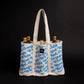 Wine Bottle tote bag with blue print. Repeat pattern that says White, red, rosé and orange.