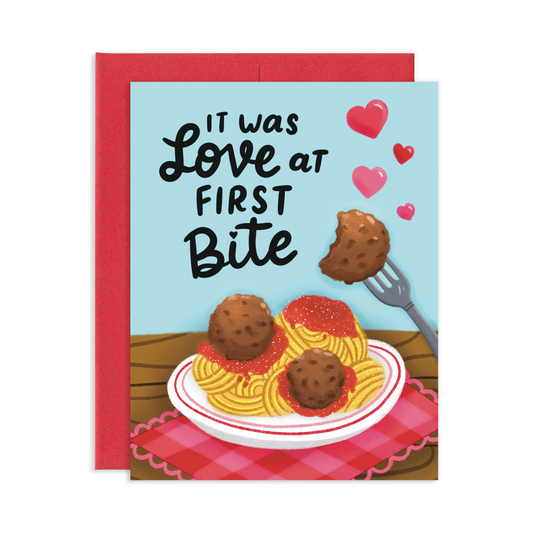 Card with spaghetti and meatballs illustration and 'It was love at first bite' text.