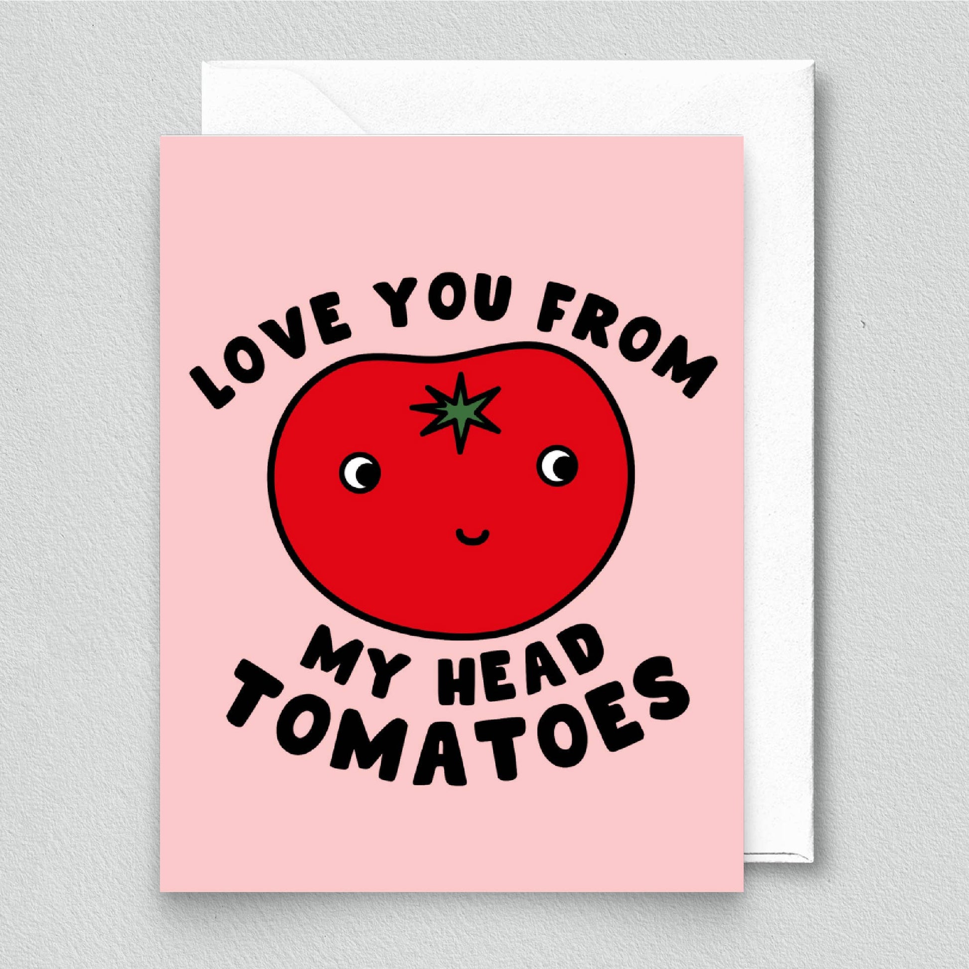 Greeting card with a tomato illustration and text that says "Love you from my head tomatoes" on a pink background