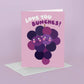 greeting card with an illustrated bunch of purple grapes and text above that reads "love you bunches" 
