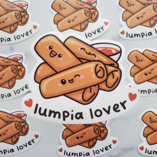 A sticker with 5 lumpias and sweet & sour sauce on it, with text at bottom that reads "lumpia lover"