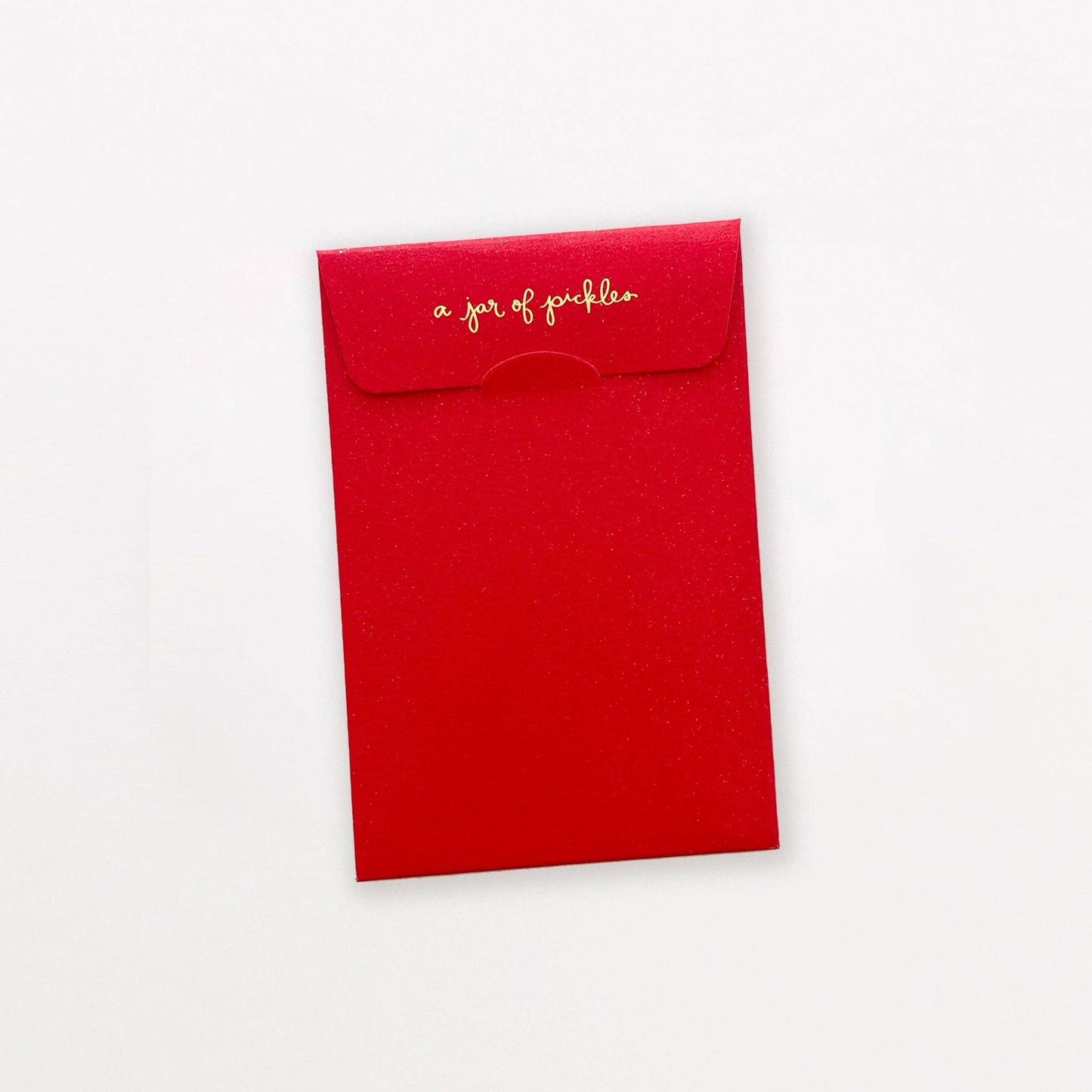 Red envelope with gold text "a jar of pickles" on a white background
