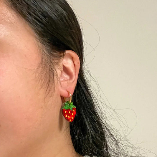 mini strawberry dangle earrings for scale 