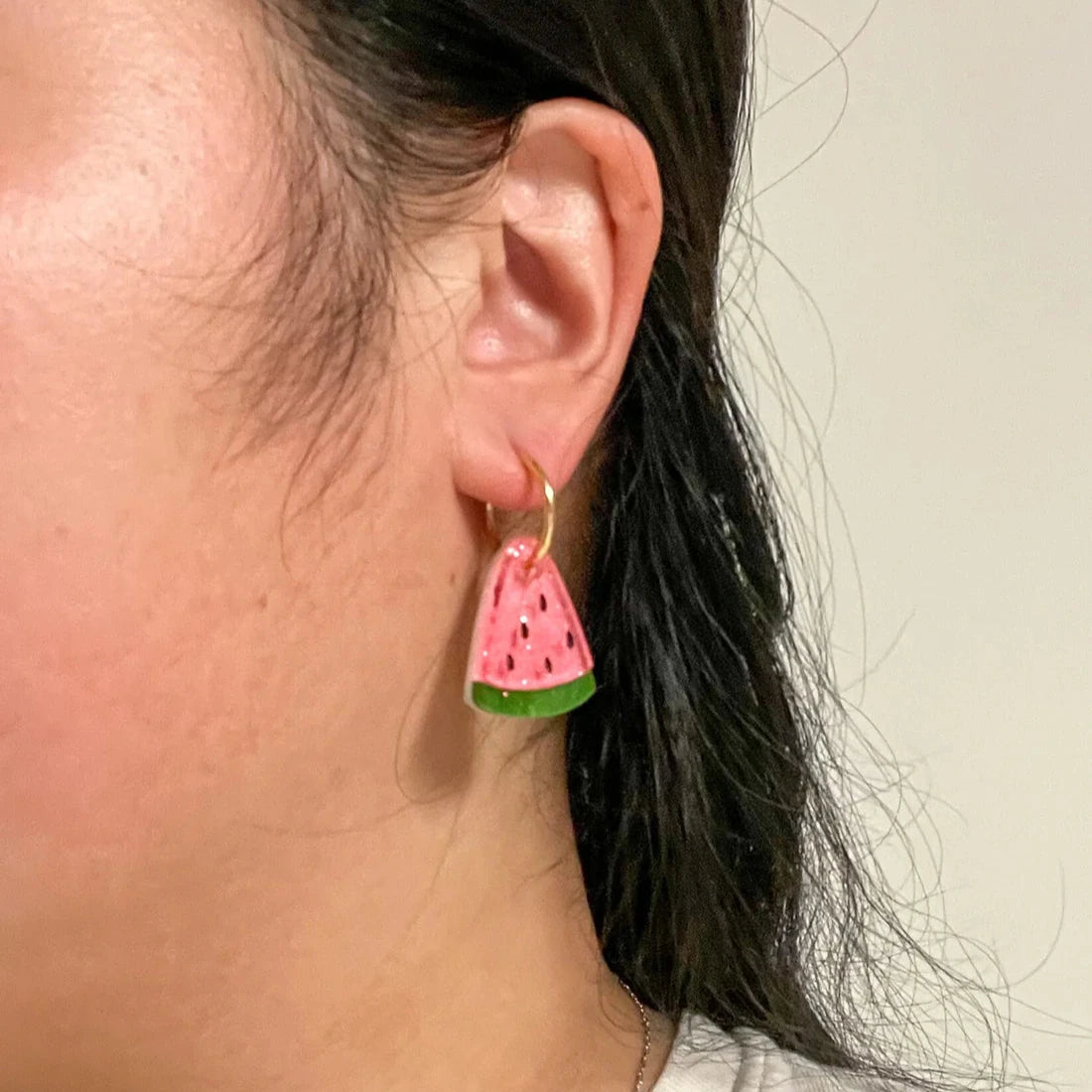 mini watermelon earrings for scale 