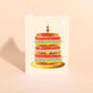 Greeting card with a stacked mortadella sandwich design on a beige background