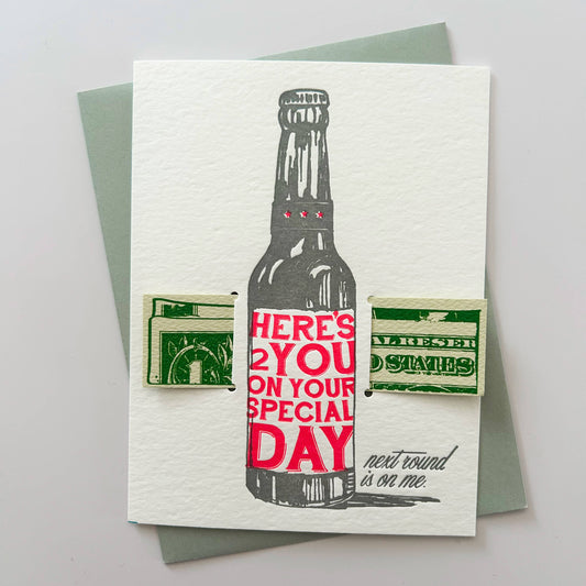 Greeting card with a bottle illustration and text on a gray background