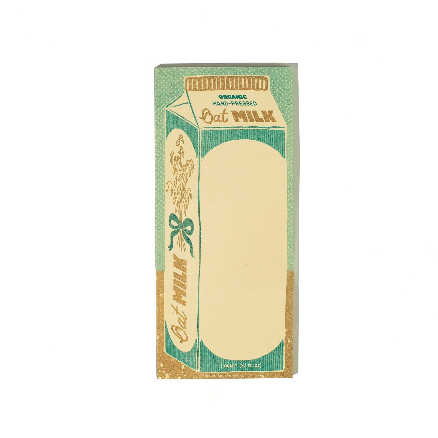 Notepad with an oat milk carton illustration on it with a green and beige design on a white background