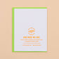 White card with yellow text and green border on a beige background