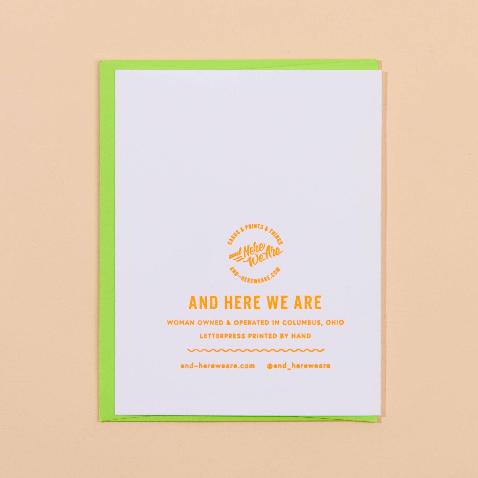 White card with yellow text and green border on a beige background