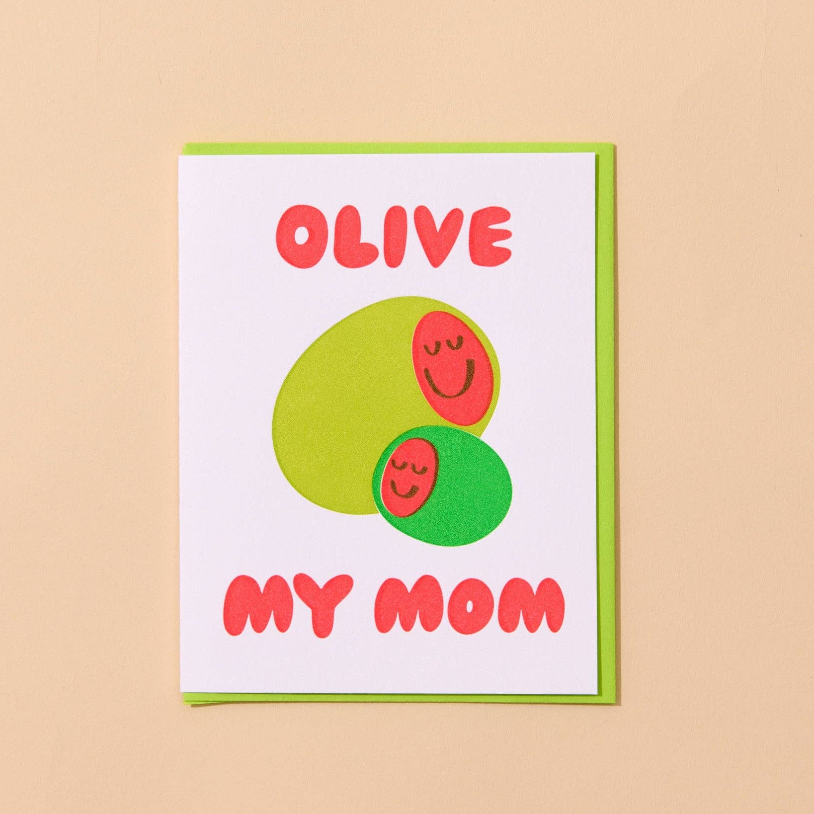 Card with green and red olive design on a beige background