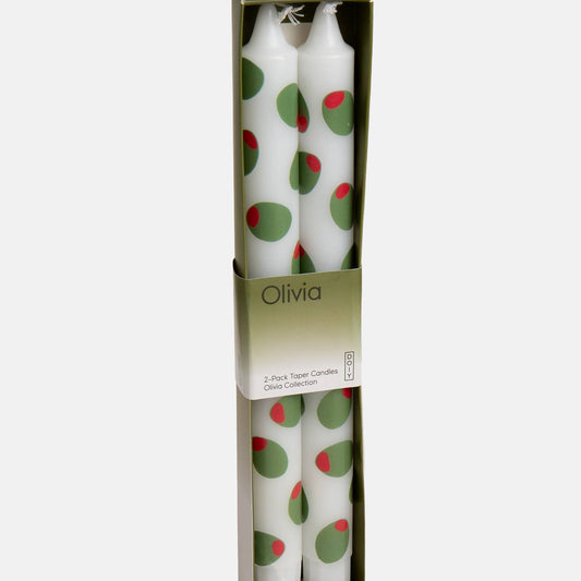 Two white candles with stuffed green olive design in a box labeled 'Olivia'.