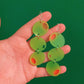 neon green and pink stuffed olive acrylic drop earrings 