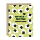 Graduation card with rice ball pattern and text 'You held it together. Congrats grad!' on a white background.