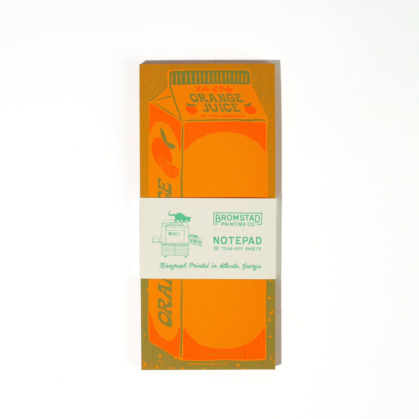 Notepad packaging designed to look like an orange juice carton with 'Bromstad Printing Co.' branding.