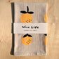 Linen tea towel with oranges screen printed on it 