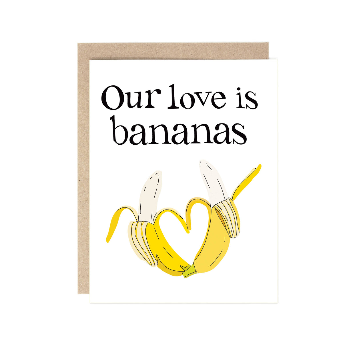 A white greeting card with a kraft envelope behind it, featuring the text 'Our love is bananas' above an illustration of two bananas forming a heart shape.
