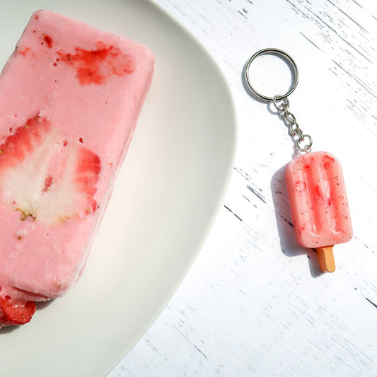 keychain with a mini paletas de fresa charm on it