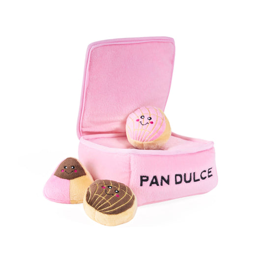 Plush pink pastry box with 'Pan Dulce' text and three toy pastries on a white background
