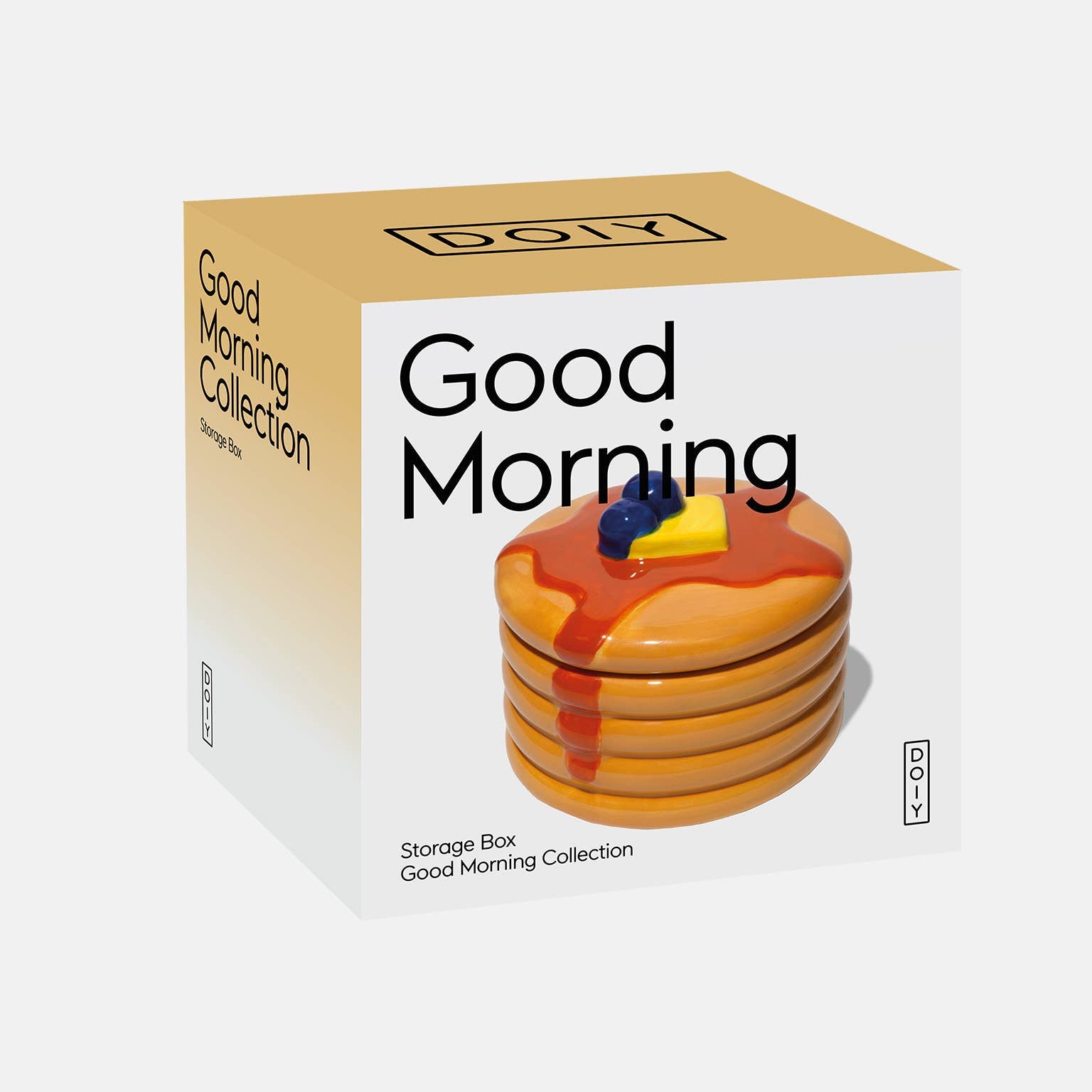Storage box with 'Good Morning' text and a stack of pancakes on a white background