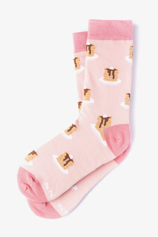 Pink socks designed with stacks of pancakes on a white background