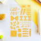Set of yellow pasta-shaped stickers on a white surface with a pen