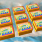 9 sardine refillable lighters lined up in 3 rows of 3 