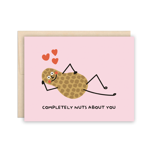 Card with a peanut laying down, propped up with one arm and 3 hearts around its head. Text at bottom reads "completely nuts about you" 