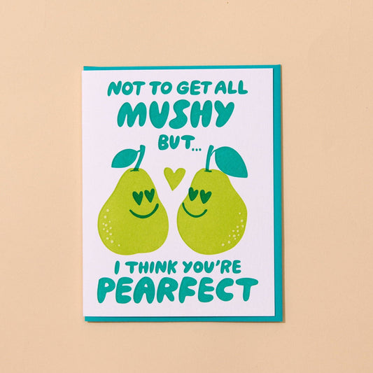 Card with two smiling pears and text "not to get all mushy but I think you're pearfect" on a beige background
