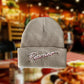 gray knit beanie with "Pecorino" stitched across the front band/fold