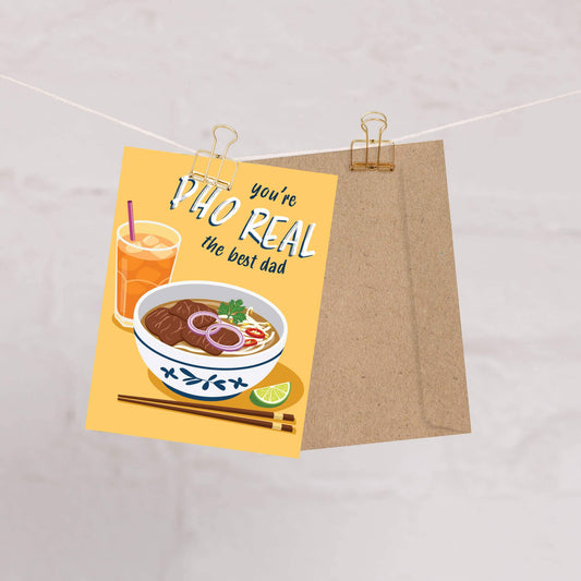 Greeting card with a bowl of soup and a drink, text 'you're the best dad', on a beige background.