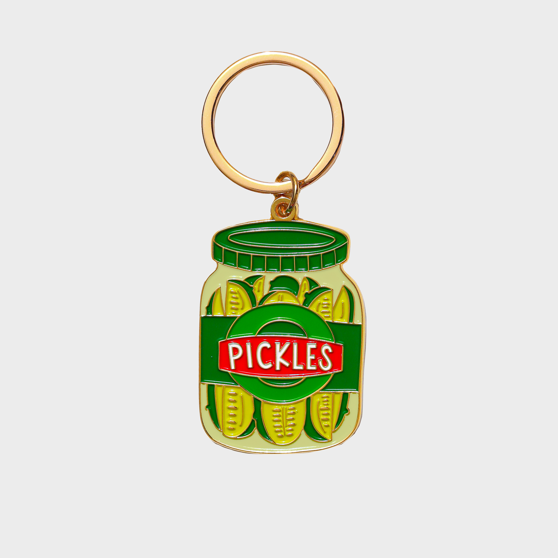 Keychain shaped like a jar of pickles with a gold ring on a white background