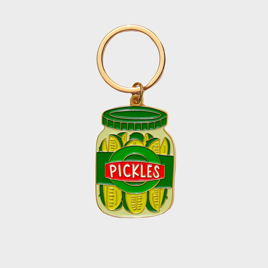 Keychain shaped like a jar of pickles with a gold ring on a white background
